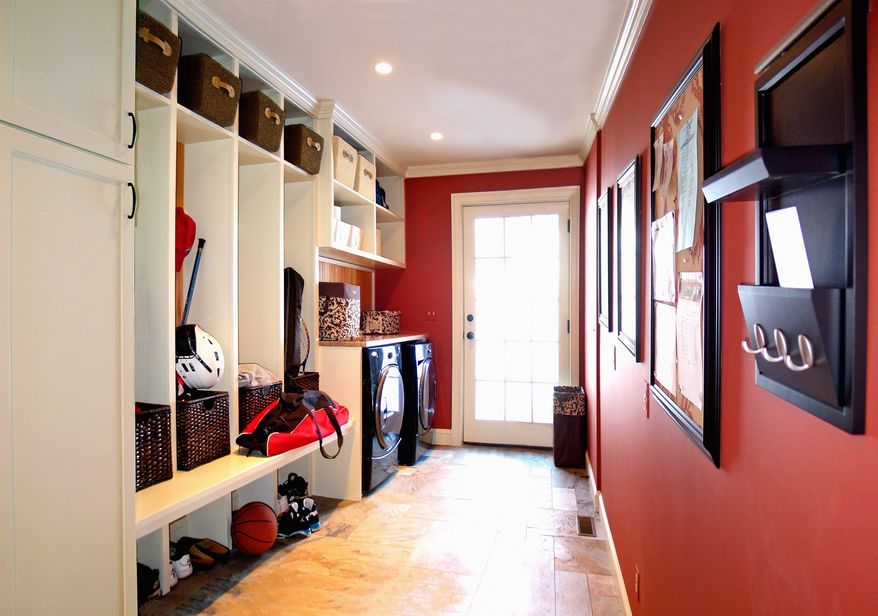 While the color scheme of the mudroom often is an extension of nearby rooms, some homeowners choose to make it a space in which to play with color. (Photo courtesy of Rill Architects/Kay Kim)