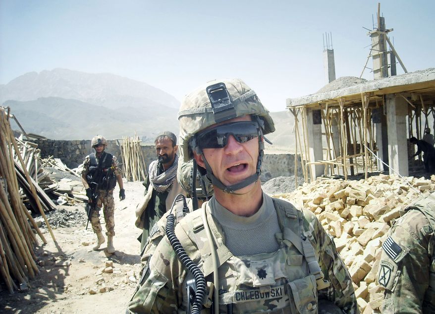 U.S. Lt. Col. William Chlebowski meets frequently with an Afghan informant who tips coalition forces to the location of roadside bombs and weapons caches and shares information about what militants are doing and planning. (Associated Press)