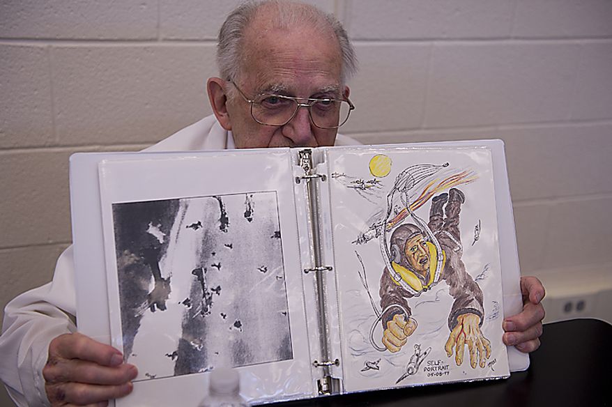 Clem Irons shows a photograph and a drawing as he recounts the story about being shot down and taken prisoner by the Germans while flying his B-17 as a member of the Army Air Corps 385th Bomb Group. Irons was one of more than 100 World War II veterans who came out to Rocky Run Middle School in Chantilly, Va., on Thursday, June 9, 2011 for the school's annual World War II Day. Students were given the opportunity to listen to first-hand stories of life during the war. (Barbara L. Salisbury/The Washington Times)