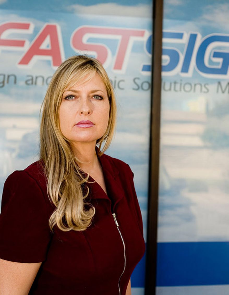 April Gilliland makes signs for a living. She uses her own business to show what she can do for customers. Yet, her tasteful, attractive signs violate the letter of the Dallas ordinance. Photo by Institute for Justice