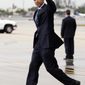 President Barack Obama waves as he arrives at Miami International Airport, Monday, June 13, 2011, in Miami. (AP Photo/Carolyn Kaster)