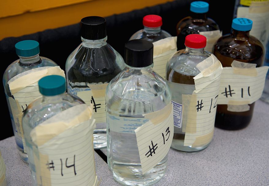 Bottles of unmarked water wait to be tasted in the 2011 Best of the Best water taste test on Tuesday at the Washington Convention Center. (Barbara L. Salisbury/The Washington Times)