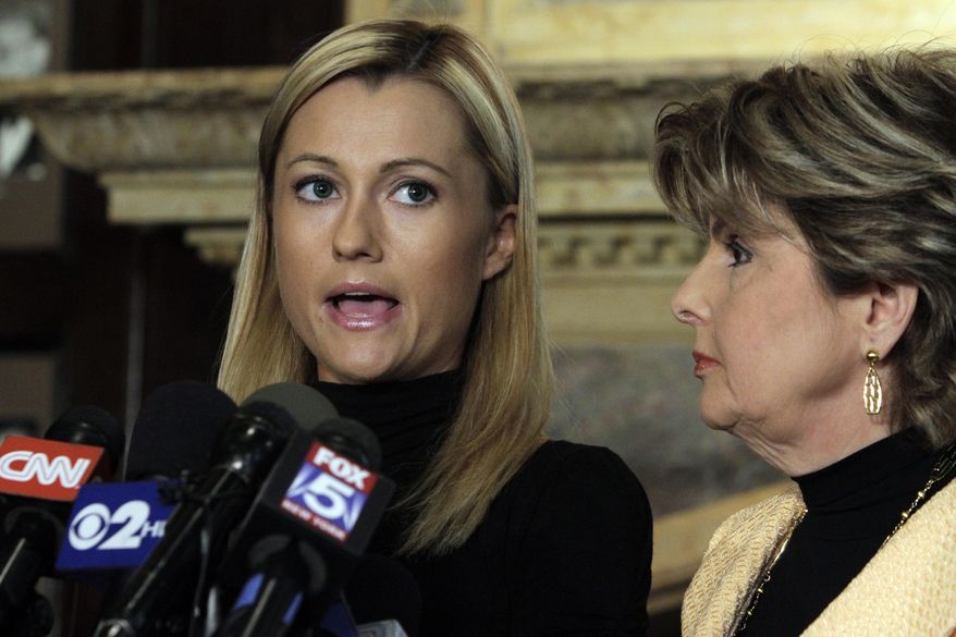Former porn actress Ginger Lee (left) reads a prepared statement as her lawyer, Gloria Allred, looks on during a news conference at the Friars Club in New York on Wednesday, June 15, 2011. Ms. Lee, who said she had exchanged emails and messages over Twitter with Rep. Anthony D. Weiner, said he asked her to lie about their online communications. (AP Photo/Richard Drew)