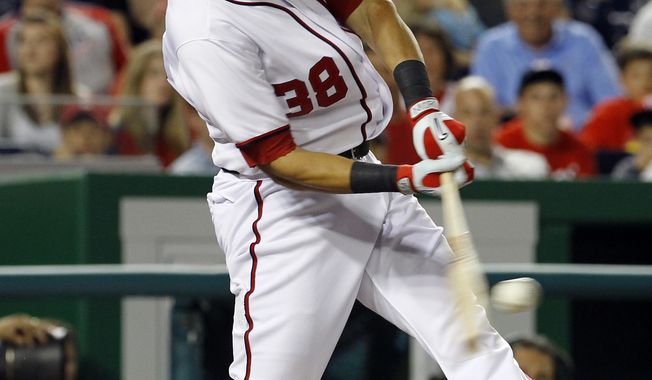 Washington Nationals slugger Michael Morse has signed a multiyear extension with the team. He batted .303 with 31 home runs and 95 RBI last season. (AP Photo/Ann Heisenfelt)