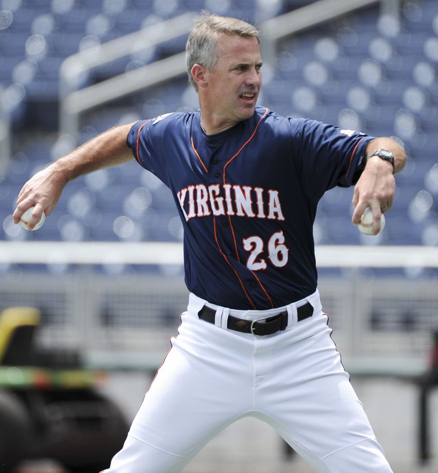 Virginia coach Brian O'Connor throws during team practice at TD Ameritrade Park in Omaha, Neb., Friday, June 17, 2011. Virginia plays California in the NCAA College World Series on Sunday. (AP Photo/Eric Francis)