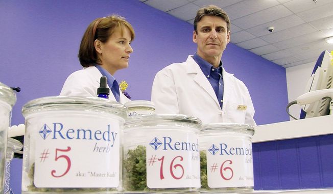** FILE ** In this June 20, 2011, file photo, more than 100 patients have signed up to buy marijuana at the Remedy Compassion Center in Auburn, Maine, where Tim and Jenna Smale opened a dispensary. They sell medical marijuana to individuals registered with the state. (Guy Taylor/The Washington Times)