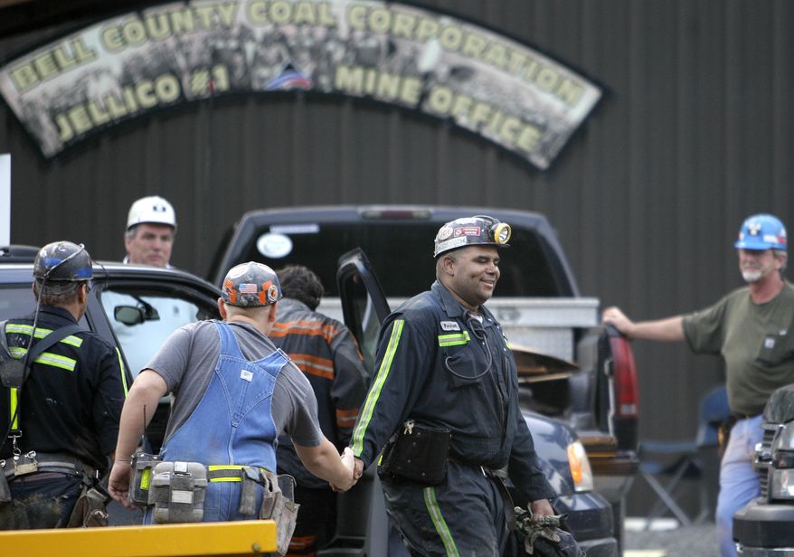 Pernell Witherspoon is congratulated after being rescued from the Jellico Mine No. 1 on Monday, June 20, 2011, in Middlesboro, Ky. (AP Photo/Ed Reinke)