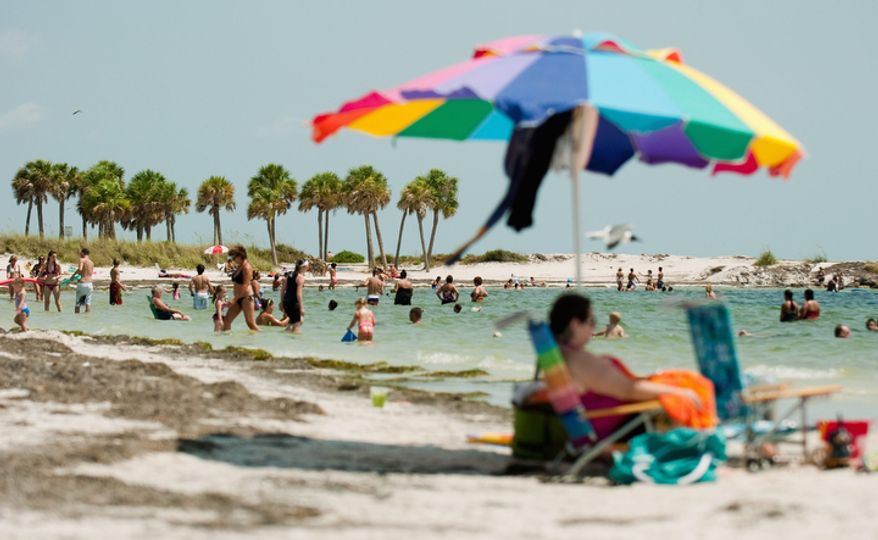 The first day of summer was ushered in Tuesday with temperatures in the 90's for most of the Tampa Bay area. (AP Photo/The Tampa Tribune, Chris Urso)