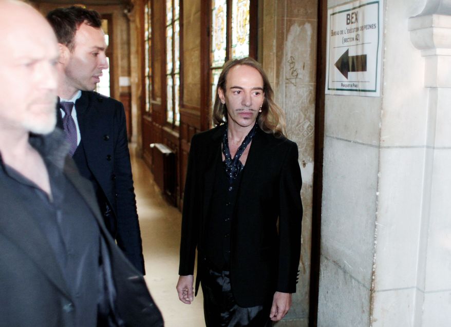 ASSOCIATED PRESS
Former Dior designer John Galliano arrives at a Paris courthouse on Wednesday where he was on trial on charges that he hurled anti-Semitic slurs in a Paris cafe.