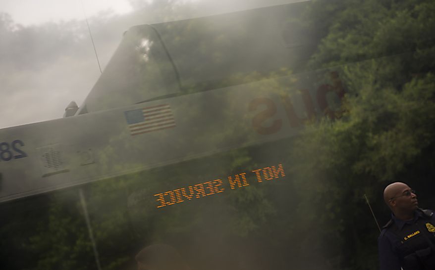 A Metrobus is parked near the Fort Totten Metro Station in Washington, D.C., on June 22, 2011. Nearly two years prior, a Metrorail crash near the station killed nine people and injured numerous others. (Rod Lamkey Jr./The Washington Times)