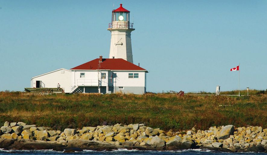 The Canadian flag flies at this lighthouse on Machias Seal Island, which is claimed by both the United States and Canada. "There's a saying here: 'You know what we call the border when it's foggy?'" native Bob Peacock said. "Opportunity." (Associated Press)