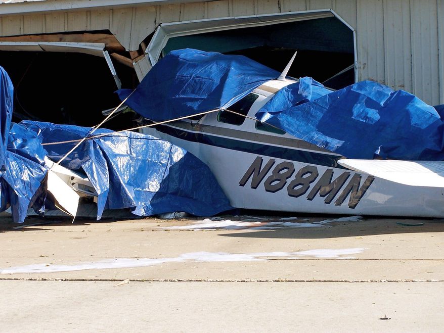 The wreckage of the plane that killed Dr. Stephen Hatch and his wife, Kim, on Friday is seen in Charlevoix, Mich. Austin Hatch, 16, is in critical condition. (Associated Press)