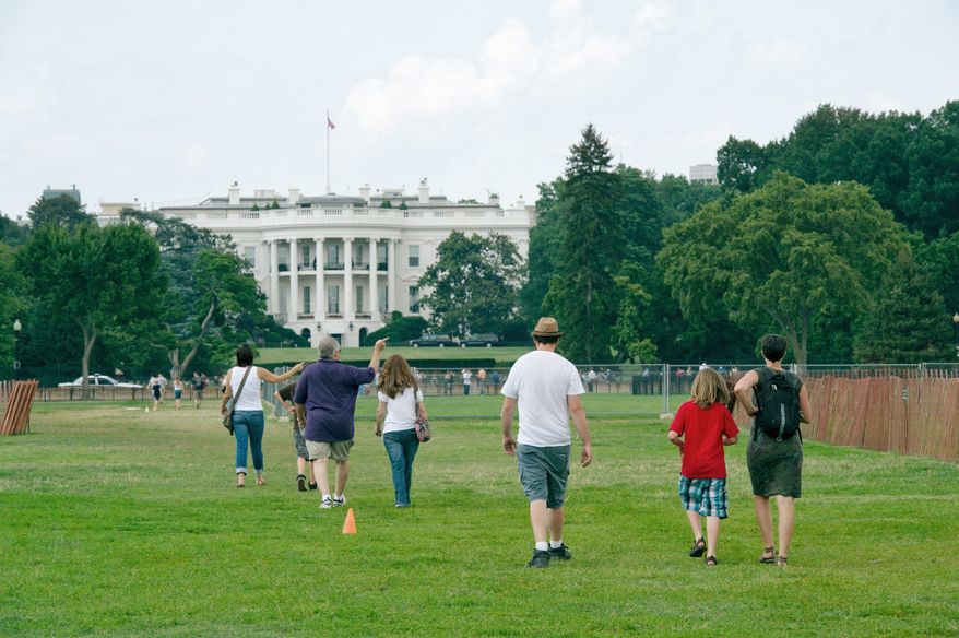 Visitors make their way up a makeshift grass path across the Ellipse to the South Lawn of the White House on Tuesday. The entire area, also called President's Park South, is set to be revamped after the National Capital Planning Commission invited five architectural-design firms from around the country to present plans for a new design. (Barbara L. Salisbury/The Washington Times)