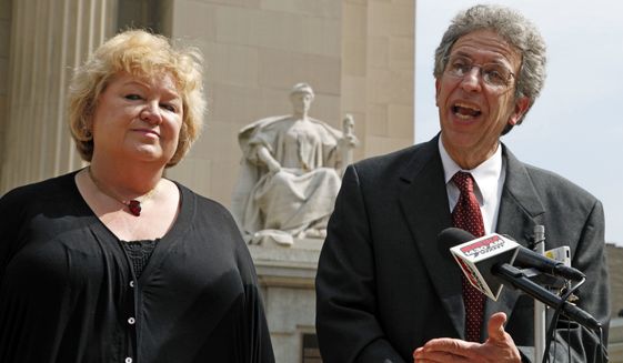 ** FILE ** Betty Cockrum, left, president of Planned Parenthood of Indiana and attorney Ken Faulk discuss a hearing in federal court where the group is seeking a injunction against a law ending most of their state funding, outside the Federal Courthouse in Indianapolis, Monday, June 6, 2011. (AP Photo/Michael Conroy)