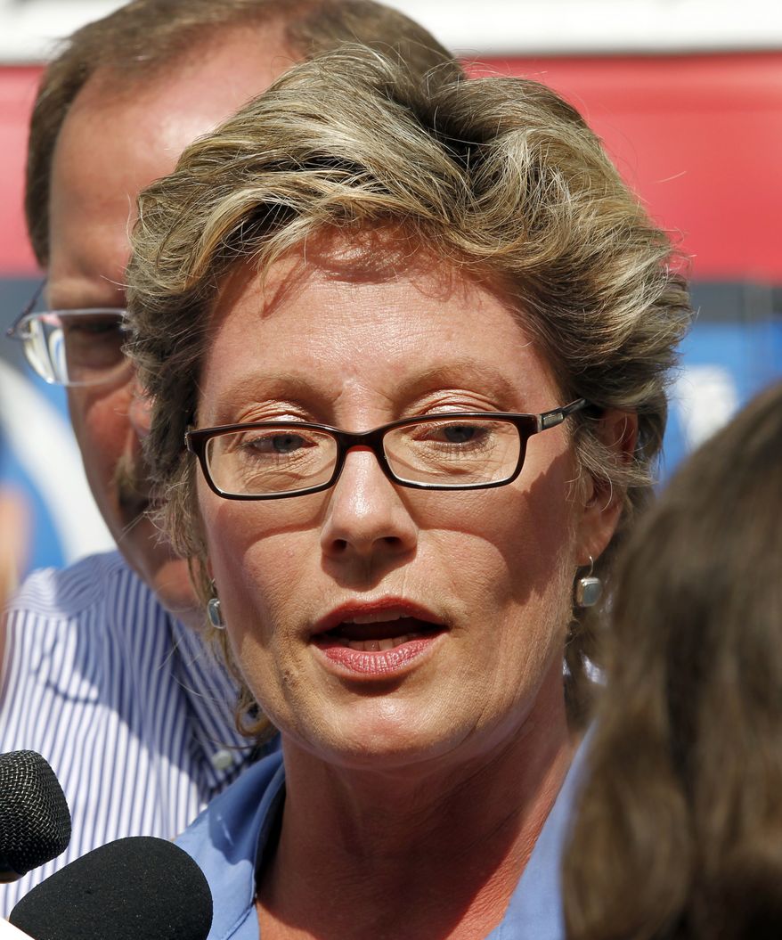 ** FILE ** Sue Swayze, a lobbyist for Indiana Right to Life, discusses a hearing in federal court where Planned Parenthood of Indiana is seeking a injunction against a law ending most of their state funding outside the Federal Courthouse in Indianapolis, Monday, June 6, 2011. (AP Photo/Michael Conroy