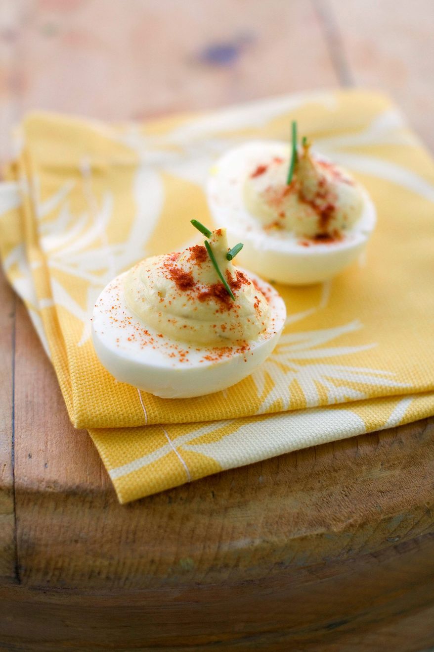 ASSOCIATED PRESS
Deviled eggs are a classic accompaniment to summer picnics and barbecues. They can be prepared in such a way that the fat and calories that come with them are reduced.
