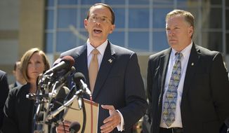 U.S. Attorney for the District of Maryland Rod J. Rosenstein (center) is flanked by Internal Revenue Service-Criminal Investigation Acting Special Agent in Charge, Jeannine A. Hammett (left) and FBI Special Agent in Charge Richard A. McFeely (right) as he makes a statement to reporters to announce that Prince George&#x27;s County Councilwoman Leslie Johnson, 59, wife of former Prince George&#x27;s County Executive Jack Johnson, pleaded guilty to the charge of conspiring to obstruct a federal corruption investigation, at the U.S. District Court in Greenbelt, Md., Thursday, June 30, 2011. (Rod Lamkey Jr/The Washington Times)
