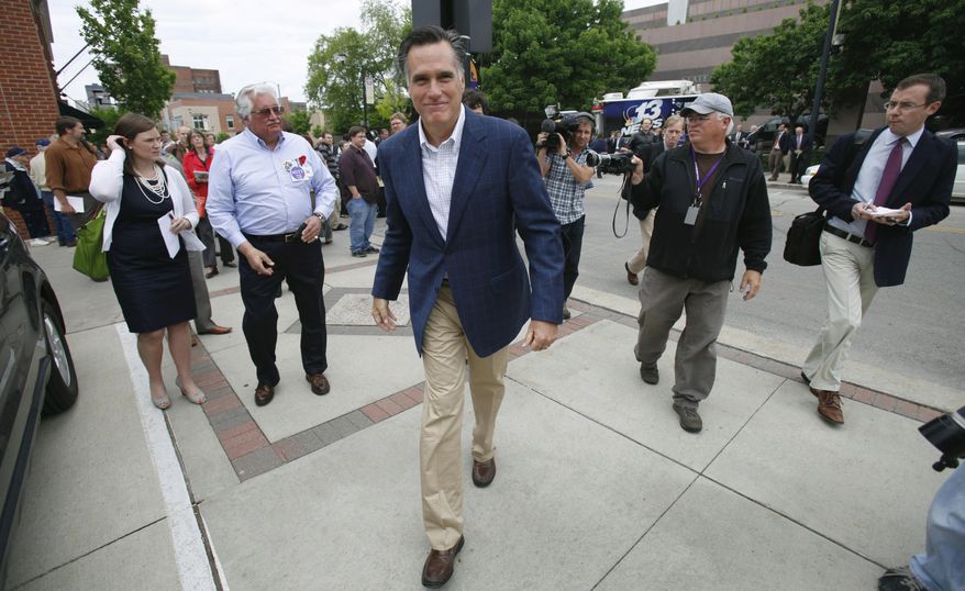 ** FILE ** In this May 27, 2011, file photo former Massachusetts Gov. Mitt Romney heads to his car after speaking at the Mediacom 2012 Presidential Candidate Series in Des Moines, Iowa. The accelerating GOP presidential campaigns in Iowa probably will define front-runner Romney’s chief challengers over the next six weeks and could oblige him to reconsider his decision to mount only modest efforts in this early voting state. (AP Photo/Charlie Neibergall, File)