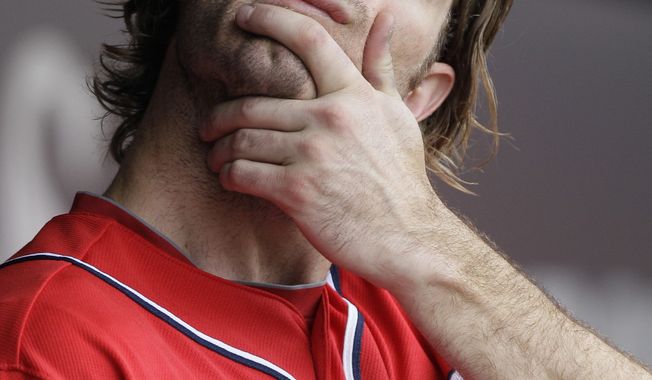 Washington Nationals&#x27; Jayson Werth stretches in the dugout during the second inning of an interleague baseball game against the Chicago White Sox in Chicago, Saturday, June 25, 2011. The White Sox won 3-0. (AP Photo/Nam Y. Huh)