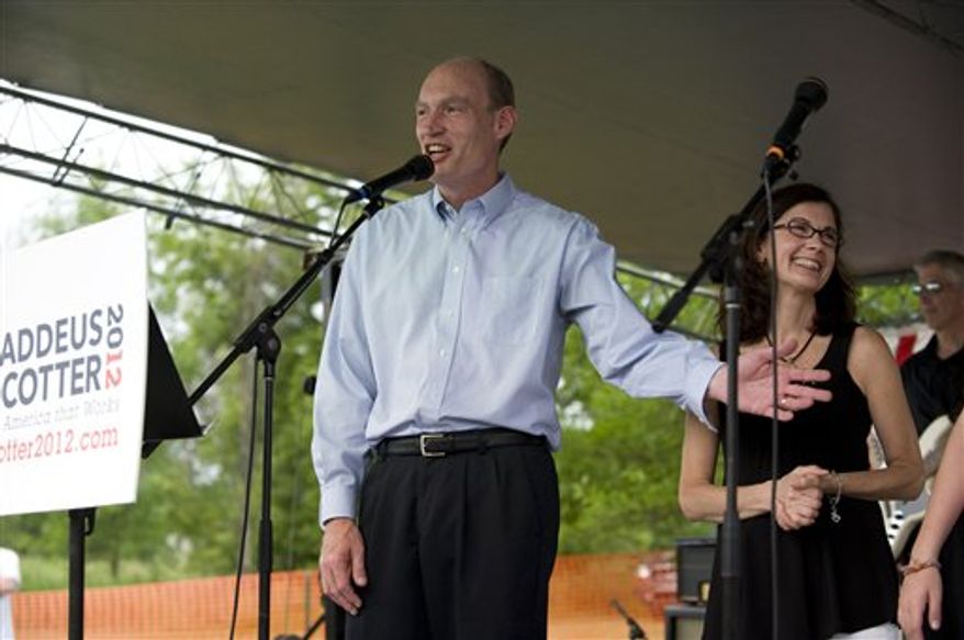 Rep. Thaddeus McCotter, Michigan Republican, jokes with a crowd of about 150 supporters at the WAAM Freedom Fest in Whitmore Lake, Mich., on Saturday, July 2, 2011, where Mr. McCotter announced his candidacy for president. Mr. McCotter's wife, Rita, and two of his children, Timothy and Emilia, joined him onstage. (AP Photo/Lon Horwedel)