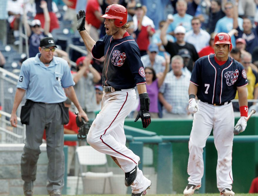 ASSOCIATED PRESS
Right fielder Jayson Werth scores on a wild pitch in the 10th inning of Monday's game. Werth stole third to set the stage for the Nationals' 5-4 Independence Day victory over the Chicago Cubs.
