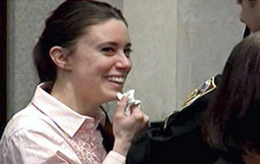 Casey Anthony smiles as she returns to the defense table after being acquitted of murder charges at the Orange County Courthouse in Orlando, Fla., Tuesday, July 5, 2011. (AP Photo/Pool)