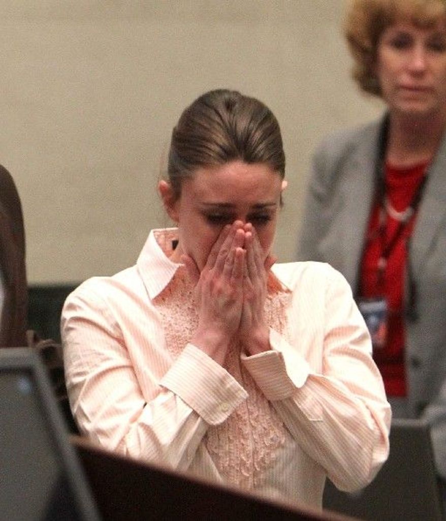 Casey Anthony reacts on Tuesday, July 3, 2011, at the Orange County Courthouse in Orlando, Fla., after a jury acquitted her of murdering her daughter, Caylee.