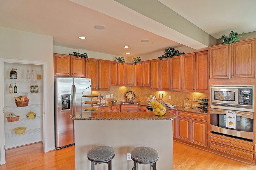 The Piedmont model at Hopewell's Landing has a center-island kitchen that opens to the adjacent breakfast area and the family room.