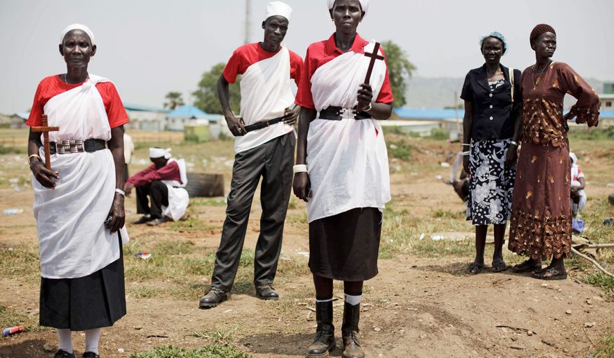Residents of Jonglei state gather Thursday for a rehearsal of independence celebrations in Juba, southern Sudan. The new country is set to officially declare its separation from the north on Saturday. Sudanese President Omar Bashir, indicted for alleged war crimes, is expected to attend. (Associated Press)