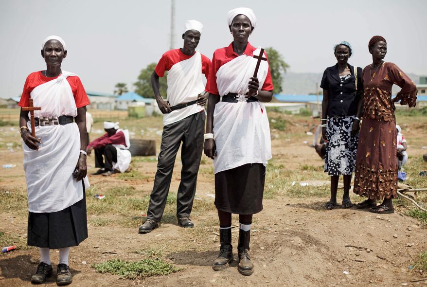 Residents of Jonglei state gather Thursday for a rehearsal of independence celebrations in Juba, southern Sudan. The new country is set to officially declare its separation from the north on Saturday. Sudanese President Omar Bashir, indicted for alleged war crimes, is expected to attend. (Associated Press)