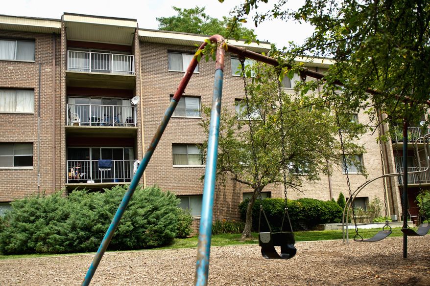 ** File ** A playground at Grand Bel Manor Apartments in Olney, Maryland. (Drew Angerer/The Washington Times)
