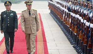 ** FILE ** Chinese Gen. Chen Bingde (left) and U.S. Navy Adm. Mike Mullen, chairman of the Joint Chiefs of Staff, review an honor guard during a welcoming ceremony for Adm. Mullen at the Bayi Building in Beijing on Monday, July 11, 2011. (Associated Press)