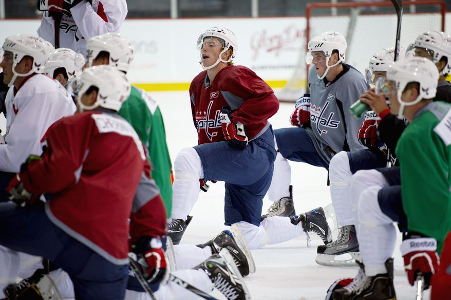 Rod Lamkey Jr./The Washington Times
Prospect Cody Eakins (center) is trying to make the Capitals' roster in his second season with the organization.