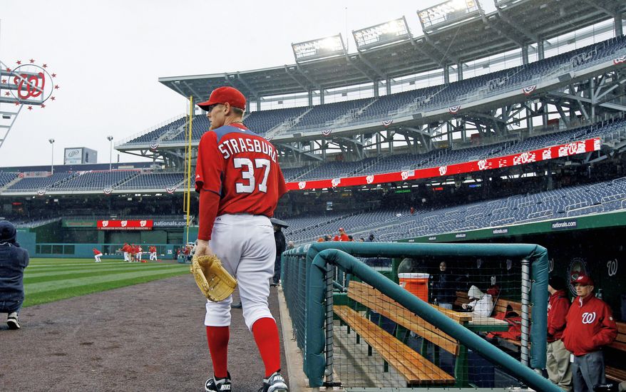Washington Nationals pitcher Stephen Strasburg steps onto the field for practice at Nationals Park on Wednesday, March 30, 2011 in Washington. The Nationals home-opener is scheduled for Thursday against the Atlanta Braves. (AP Photo/Alex Brandon)