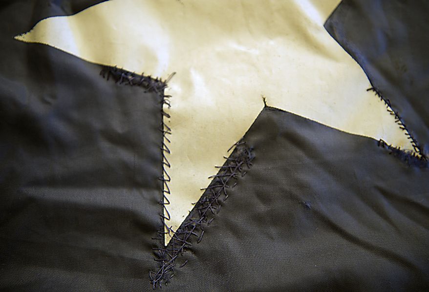 Hand stitching can be seen on one of the stars on the official 9/11 National flag, which was in Washington, D.C., on Thursday, July 14, 2011. The flag, which was flying just south of the World Trade Center on Sept. 11, 2001, is making its way around the country and is being stitched back together by Americans, many of whom have suffered their own tragedies. The goal is for the flag to be completed by this Sept. 11, in time for the 10th anniversary of the attacks. (Barbara L. Salisbury/The Washington Times)
