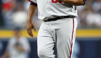 Washington Nationals starting pitcher Livan Hernandez digs at the mound after allowing a run in the first inning a baseball game against the Atlanta Braves in Atlanta on Friday. Atlanta won 11-1 and Hernandez allowed six runs (three earned) in four innings. (AP Photo/John Bazemore)