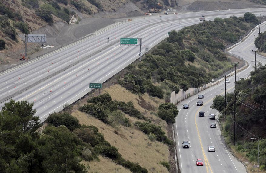 Traffic moves along Sepulveda Boulevard on Saturday, July 16, 2011, as a 10-mile stretch of Interstate 405 is shut down to demolish the Mulholland Drive bridge in Los Angeles. (AP Photo/Jae C. Hong)