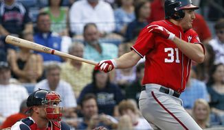 Washington Nationals&#39; John Lannan recorded his first two hits of the season Saturday against the Atlanta Braves - driving in two runs on a second-inning single up the middle. The Nats won 5-2. (AP Photo/John Bazemore)