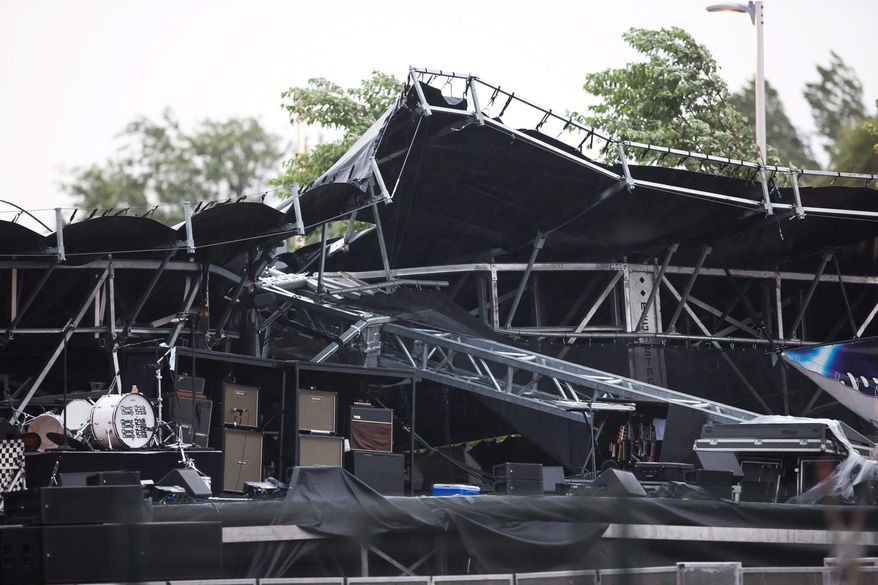 The main stage at the Ottawa Bluesfest collapsed during a severe thunderstorm that sent thousands of people running for cover on Sunday, July 17, 2011, in Ottawa. (AP Photo/Canadian Press, Leon Switzer)