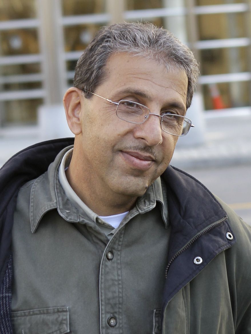 ** FILE ** Mohammed Wali Zazi leaves a federal courthouse in New York in December 2010. (AP Photo/Seth Wenig, File)