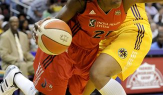 Washington Mystics forward Nicky Anosike (shown against the Los Angeles Sparks) only scored five points, but also grabbed a season-high 14 rebounds in the Mystics&#x27; 86-79 loss to the Atlanta Dream on Tuesday. (AP Photo/Gus Ruelas)