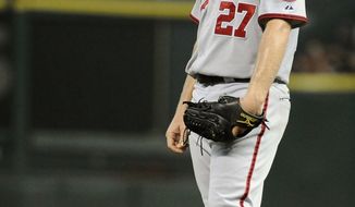Washington Nationals starting pitcher Jordan Zimmerman takes a moment off the mound in the fourth inning of a baseball game against the Houston Astros on Tuesday. Zimmermann allowed six earned runs in the Nats&#x27; 7-6 loss to the Astros. (AP Photo/Pat Sullivan)