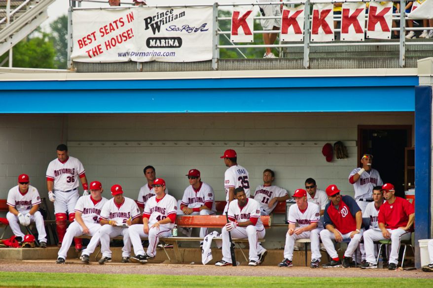 The Potomac Nationals watch from their small-sized dugout during a game against the Lynchburg Hillcats in 2011. (The Washington Times)