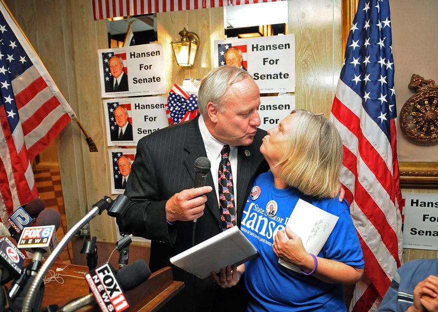 Wisconsin state Sen. Dave Hansen leans in to kiss his wife, Jane, during a victory party in Green Bay, Wis., on Tuesday, July 19, 2011. Mr. Hansen survived a recall election that gave voters the most direct opportunity yet to react to a Republican-backed law that stripped most public workers of their collective bargaining rights. (AP Photo/The Green Bay Press-Gazette, Corey Wilson)