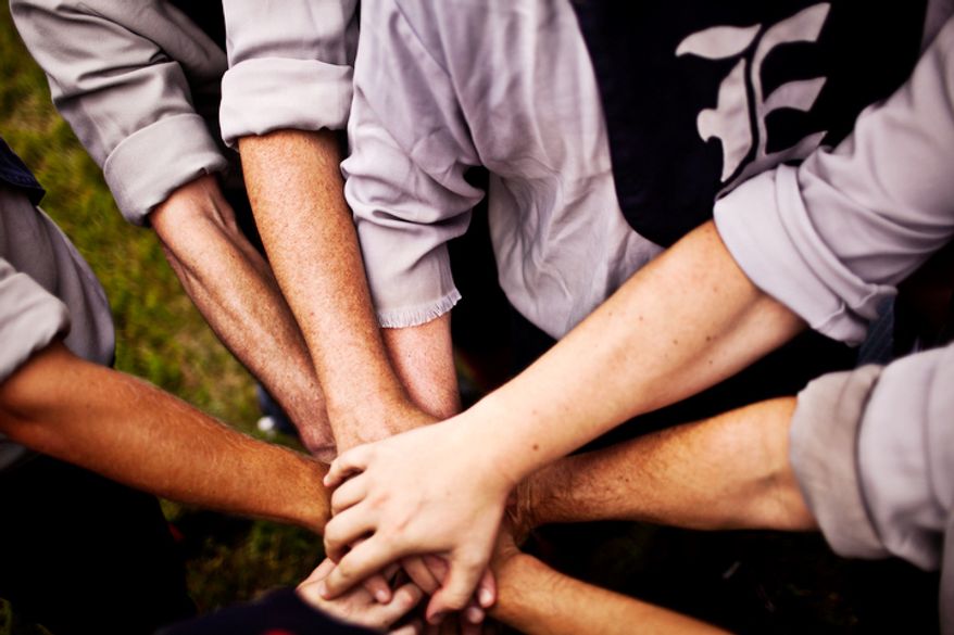 The Elkton Eclipse team, based out of Elkton, Md, gather in a circle before the game against the Potomac Nine during the Loudoun Preservation Society's 19th Century Baseball Day at the Oatlands, in Leesburg, Va., Sunday, June 12, 2011. (Drew Angerer/The Washington Times)