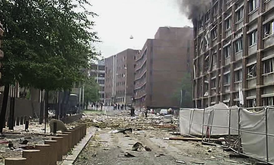 In this video image taken from television, smoke is seen billowing from a damaged building as debris is strewn across the street after an explosion in Oslo, Norway, Friday, July 22, 2011. A loud explosion shattered windows Friday at the government headquarters in Oslo, which includes the prime minister's office, injuring several people. Prime Minister Jens Stoltenberg is safe, government spokeswoman Camilla Ryste told The Associated Press. (AP Photo/TV2 NORWAY via APTN)