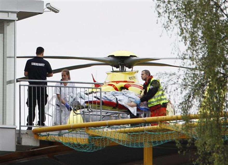 A person injured at the youth camp on the island of Utoya is taken from a helicopter into the Ullevaal Hospital in Oslo Friday July 22, 2011. At Utoya, an island outside Oslo, a gunman dressed in a police uniform opened fire at a Labor Party youth camp, shooting several youths, party spokesman Per Gunnar Dahl told The Associated Press. (AP Photo/Scanpix, Hakon Mosvold Larsen)