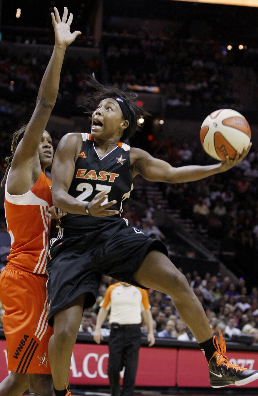 East's Cappie Pondexter shoots over West's Rebekkah Brunson during the first half of the WNBA All-Star game Saturday. East won 118-113. (AP Photo/Darren Abate)