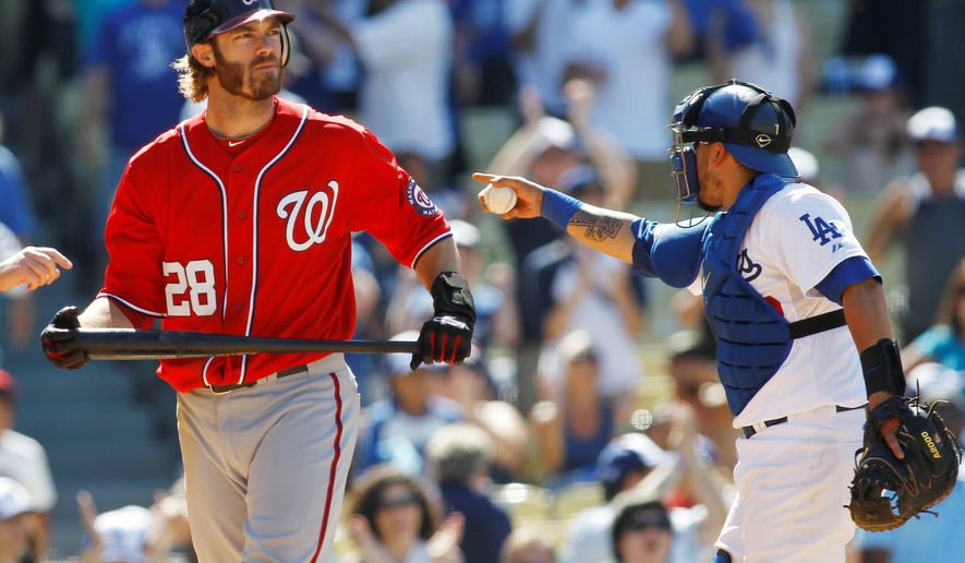 associated press
Washington Nationals&#39; Jayson Werth, left, reacts after striking out for the last out as Los Angeles Dodgers catcher Dioner Navarro, right, celebrates during the ninth inning of a baseball game, Sunday, July 24, 2011, in Los Angeles. (AP Photo/Danny Moloshok)