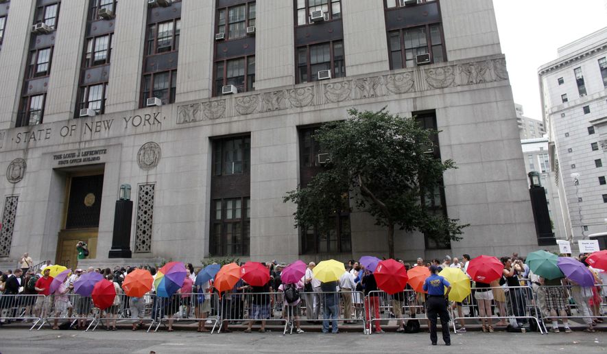 Same-sex couples wait in line to receive marriage licenses at the Manhattan City Clerk&#x27;s office on July 24, 2011. (Associated Press) **FILE**
